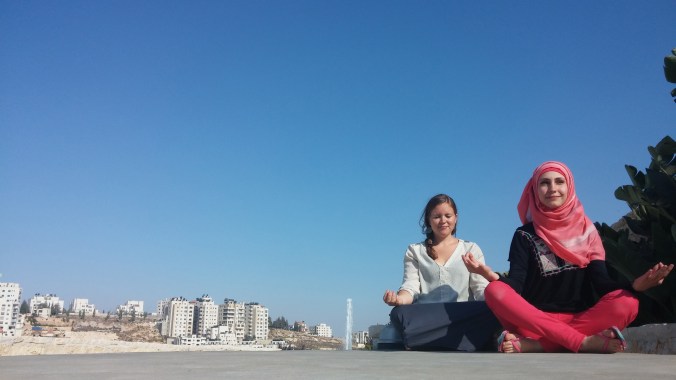 Yoga and meditation helps ground and unite us when the world around us seems to be falling apart. Here I am with my friend Hadeel in Ramallah, Palestine on the first day of Eid.